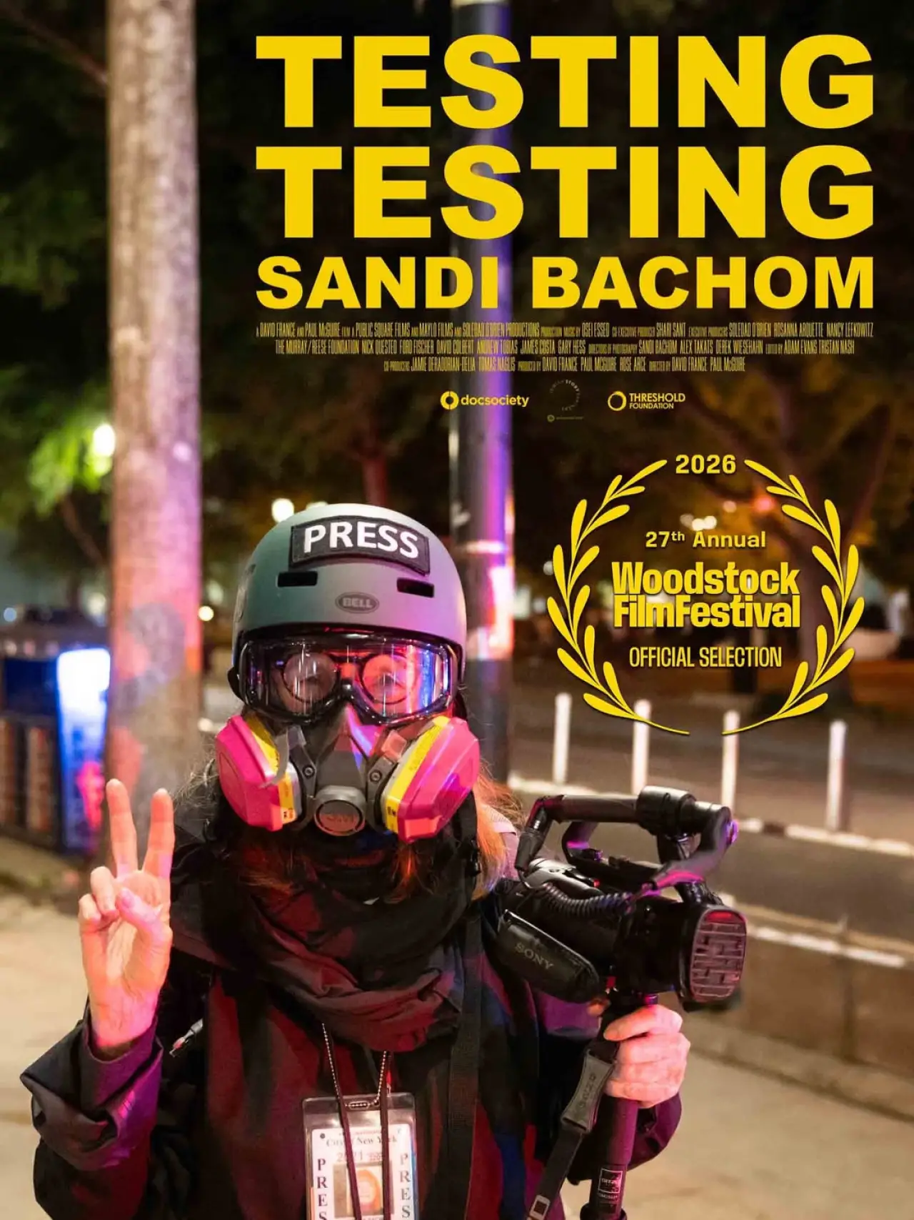 Постер до фільму "Testing Testing Sandi Bachom"