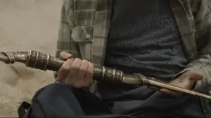 Задник до фильму"A Hero