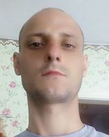 Александр Таций